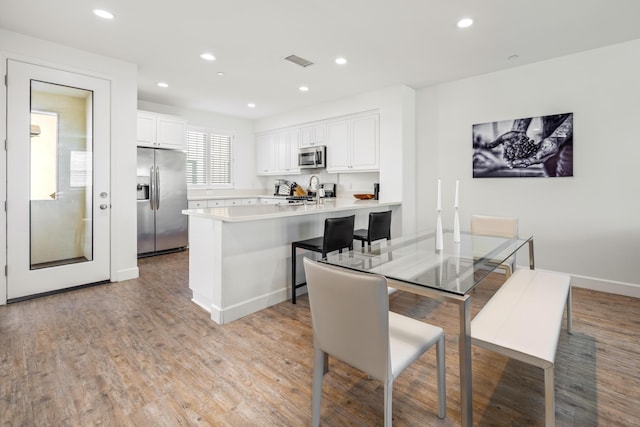 dining area featuring light hardwood / wood-style flooring