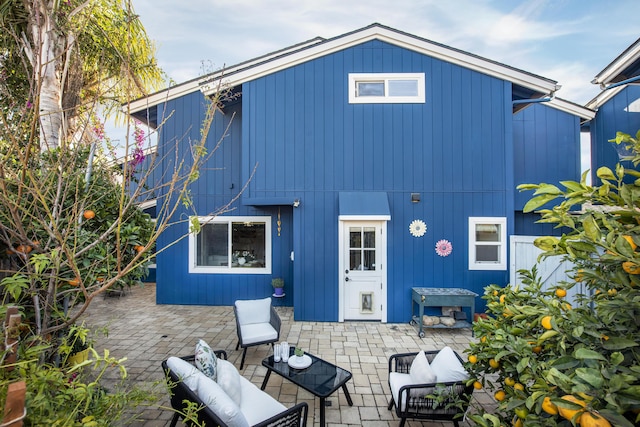 rear view of house featuring a patio