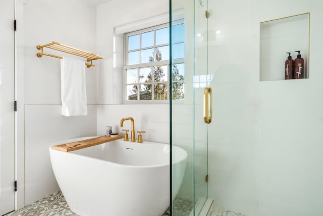 bathroom featuring a tub to relax in