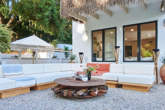 view of patio featuring an outdoor living space and a gazebo