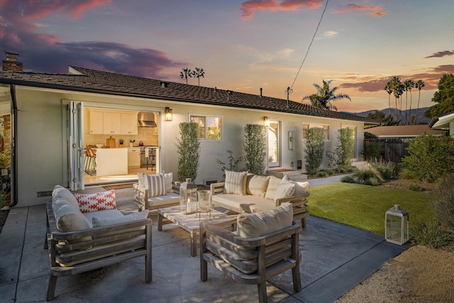 patio terrace at dusk with an outdoor living space