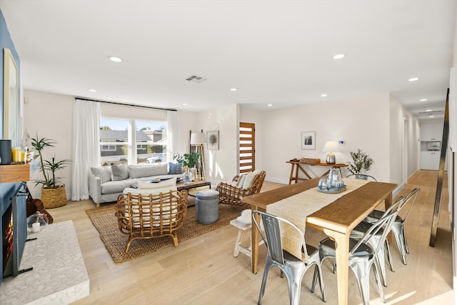 dining area featuring light wood-type flooring