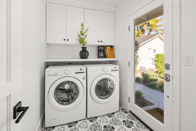 laundry area with light tile patterned flooring, separate washer and dryer, and cabinets