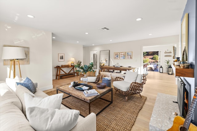 living room with light hardwood / wood-style flooring