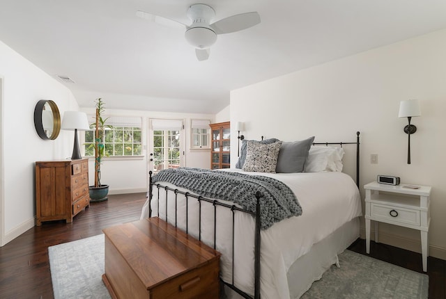 bedroom with ceiling fan, access to exterior, dark hardwood / wood-style flooring, and lofted ceiling