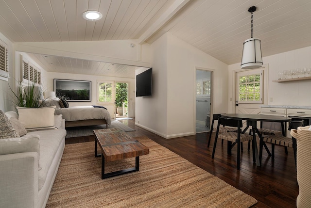 living room with plenty of natural light, dark hardwood / wood-style flooring, and lofted ceiling with beams