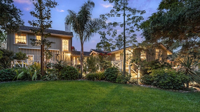 view of front of property with a yard