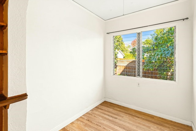 unfurnished room with light hardwood / wood-style flooring