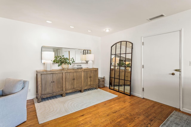 foyer entrance with light hardwood / wood-style flooring