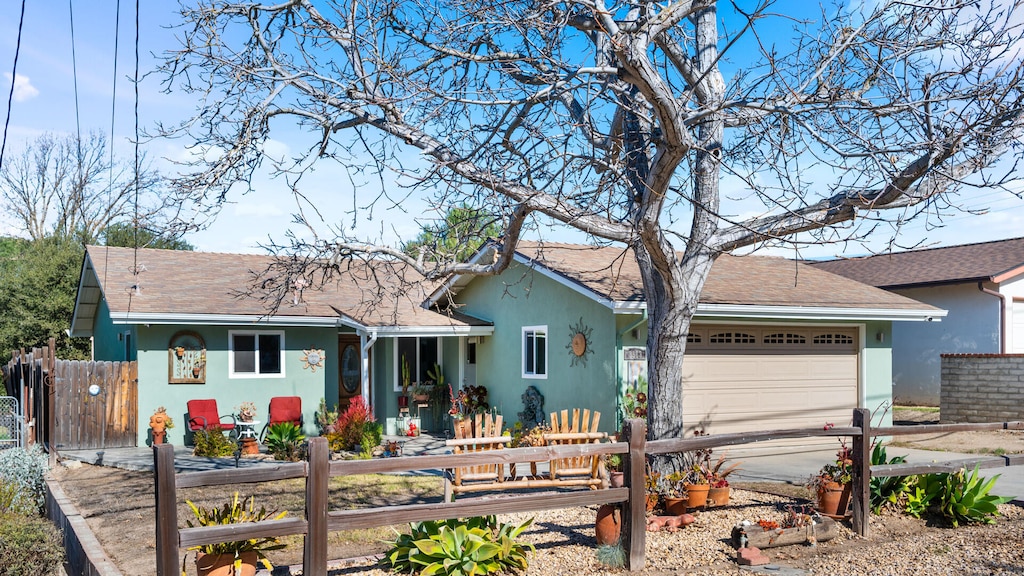 ranch-style home featuring a garage