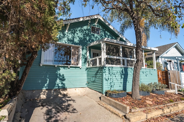 view of front of home with a sunroom