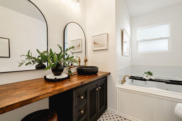 bathroom with vanity and a bathtub