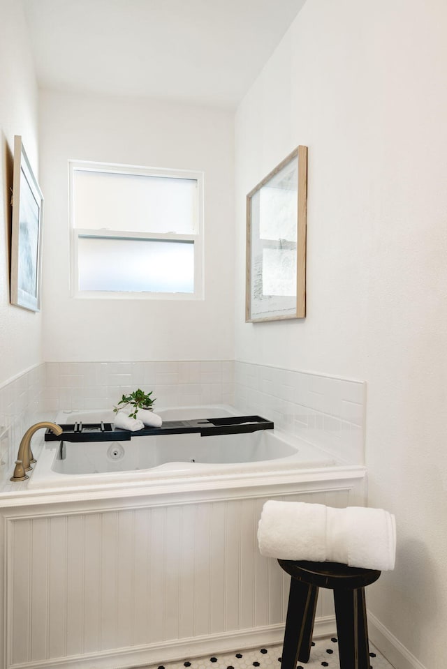 bathroom featuring a bathing tub and tile patterned flooring