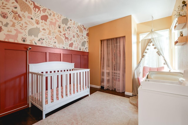 bedroom with sink and a crib