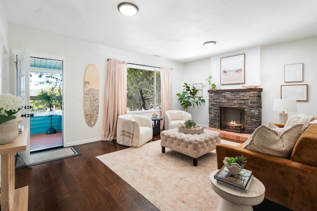 315 E Micheltorena St, Santa Barbara, CA 93101 - living room featuring baseboards, wood finished floors, and a fireplace