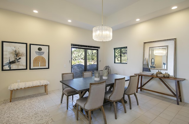 dining room with an inviting chandelier and light tile patterned floors