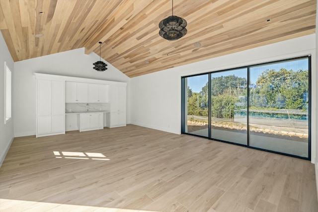 interior space with light hardwood / wood-style flooring, vaulted ceiling with beams, and wood ceiling