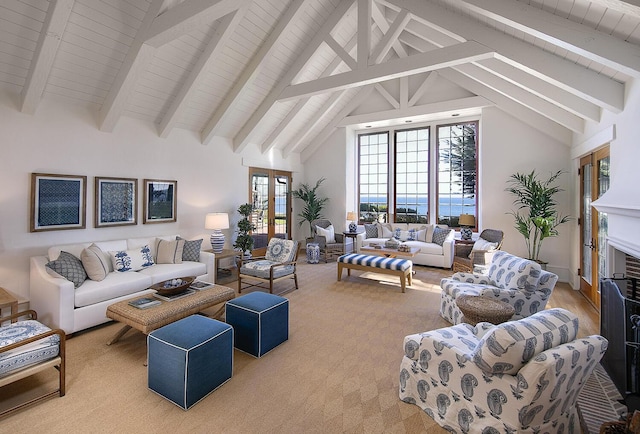 living room with beam ceiling and high vaulted ceiling