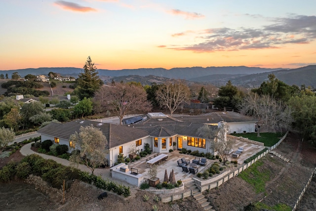 aerial view at dusk with a mountain view