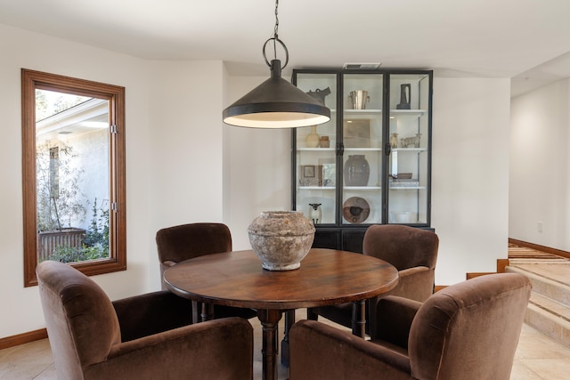 dining room with baseboards and a wealth of natural light