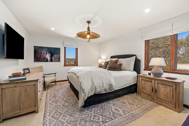 bedroom featuring multiple windows, baseboards, and recessed lighting