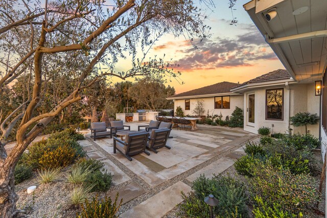 patio terrace at dusk with an outdoor hangout area