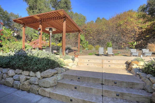 view of patio featuring a pergola