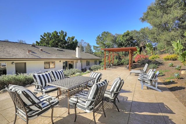 view of patio featuring an outdoor hangout area and a pergola