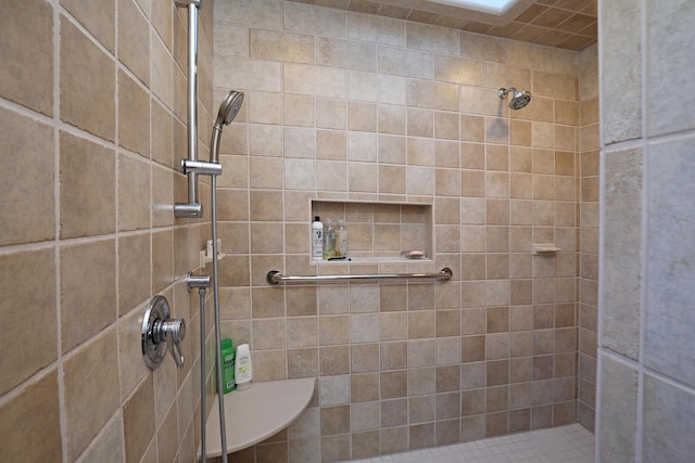 bathroom with a tile shower