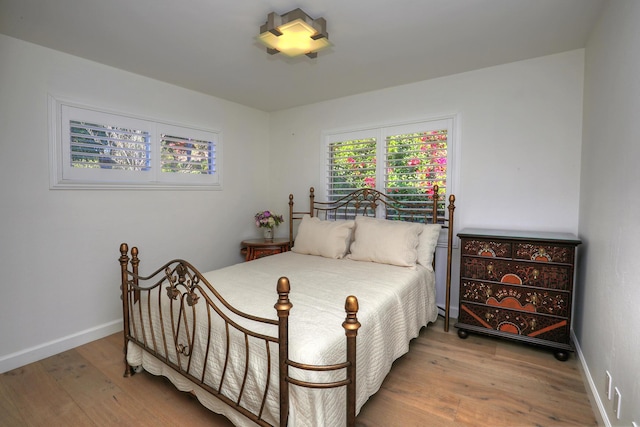 bedroom with wood-type flooring