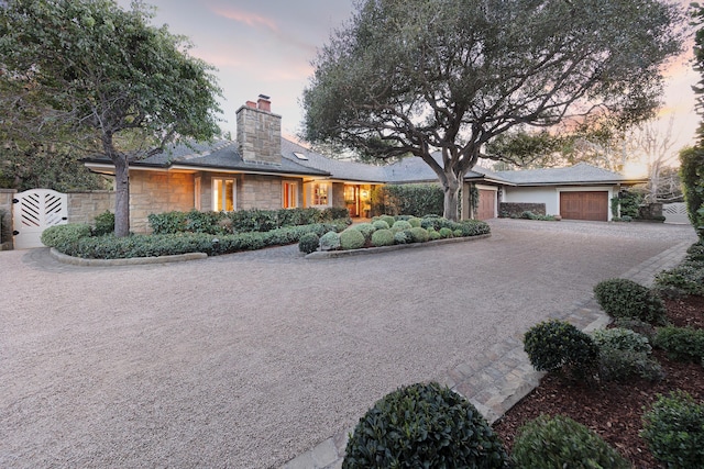 single story home with a garage