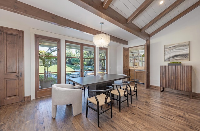 dining room with lofted ceiling with beams, a chandelier, and dark hardwood / wood-style flooring