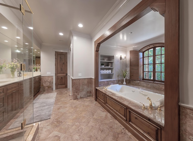 bathroom with vanity, a tub, tile walls, and crown molding