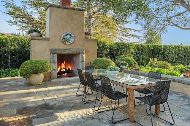 view of patio / terrace with exterior fireplace