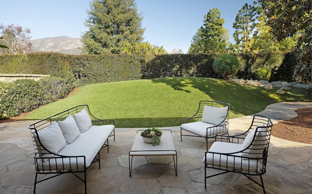 view of patio / terrace featuring a mountain view and an outdoor hangout area