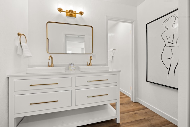 bathroom with vanity and hardwood / wood-style floors