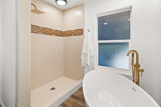 bathroom with sink, hardwood / wood-style flooring, and separate shower and tub