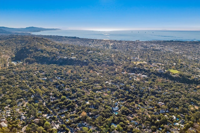 drone / aerial view featuring a water and mountain view