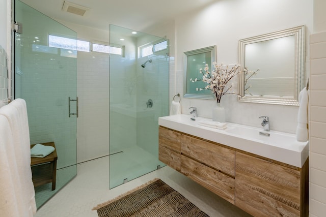 bathroom with tile patterned flooring, vanity, decorative backsplash, and a shower with shower door