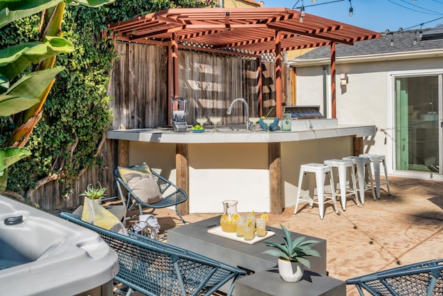 view of patio / terrace featuring an outdoor bar and a pergola