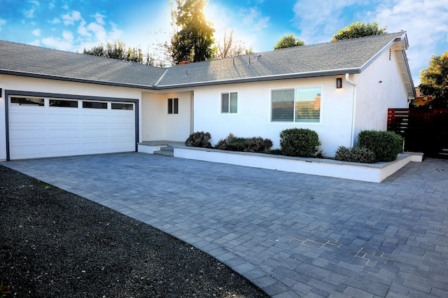 single story home featuring a garage