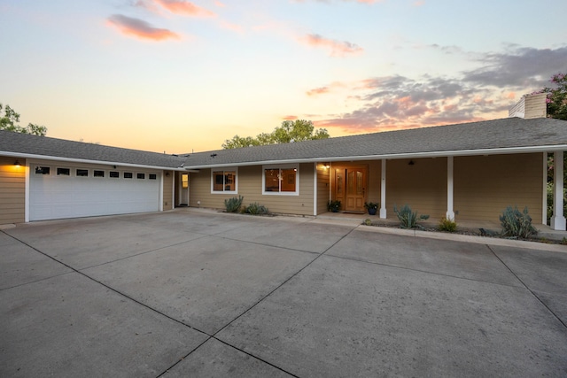 ranch-style house featuring a garage