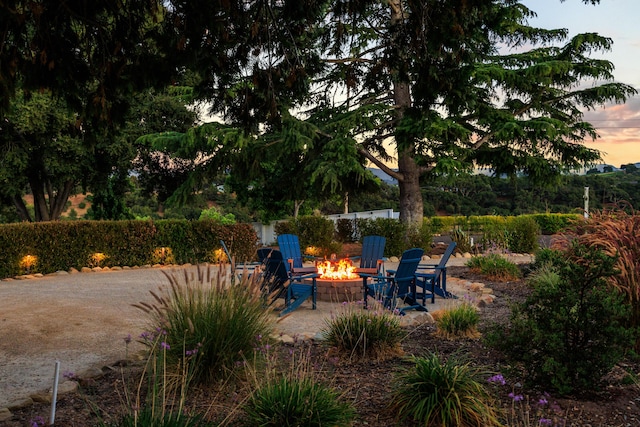 patio terrace at dusk with a fire pit