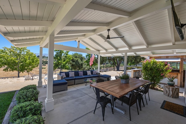 view of patio / terrace with an outdoor living space and ceiling fan