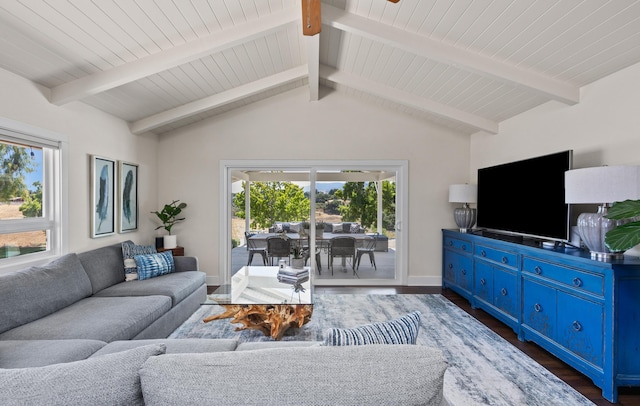 living room with vaulted ceiling with beams and dark hardwood / wood-style floors