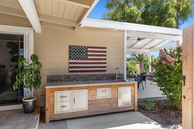 view of patio / terrace featuring area for grilling and sink