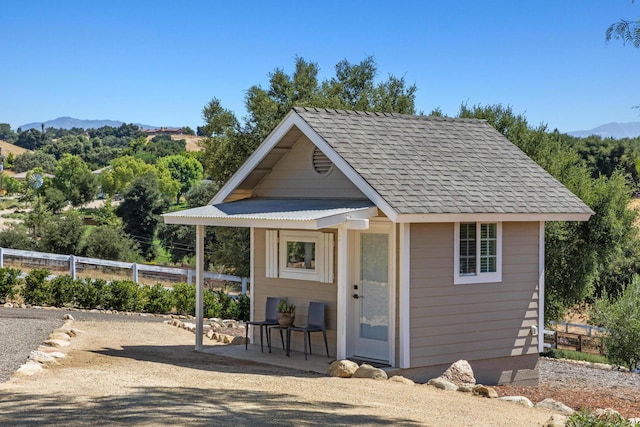 view of outbuilding with a mountain view