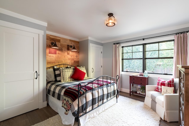 bedroom featuring crown molding and hardwood / wood-style floors