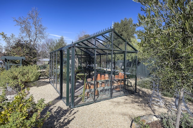 view of patio featuring an outbuilding