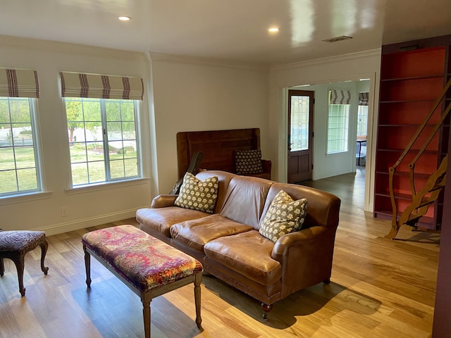 bedroom featuring light hardwood / wood-style flooring and ornamental molding